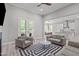 Comfortable living room features stylish furniture, hardwood floors and natural light at 59 Mill Rd, Pittsboro, NC 27312