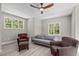 Living Room featuring a ceiling fan, a sofa, two armchairs and two windows at 59 Mill Rd, Pittsboro, NC 27312
