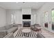 Inviting living room features a cozy fireplace and stylish, comfortable seating arrangement at 59 Mill Rd, Pittsboro, NC 27312