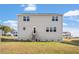 Rear view of a two-story home, featuring a wooden staircase leading to the back door at 59 Nevada Ct, Clayton, NC 27527