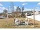 Inviting backyard with fire pit and rocking chairs perfect for outdoor entertaining at 59 Nevada Ct, Clayton, NC 27527