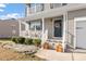 Inviting front porch features tasteful decor and charming details, enhancing the home's curb appeal at 59 Nevada Ct, Clayton, NC 27527