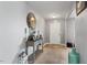 Bright hallway featuring neutral paint, carpet floors, decorative mirror, and stylish table at 59 Nevada Ct, Clayton, NC 27527