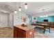 Open kitchen and dining area featuring an island and an adjacent living space at 59 Nevada Ct, Clayton, NC 27527