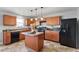 Bright kitchen featuring wood cabinets, stainless appliances, and a center island at 59 Nevada Ct, Clayton, NC 27527
