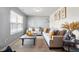 Inviting living room with lots of light, neutral colors, stylish furniture, and carpet floors at 59 Nevada Ct, Clayton, NC 27527