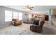 Inviting living room with comfortable seating, natural light, and open layout to the kitchen at 59 Nevada Ct, Clayton, NC 27527
