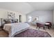Bright main bedroom featuring a sitting area, neutral decor, and natural light at 59 Nevada Ct, Clayton, NC 27527