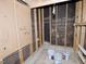 Basement utility area, with exposed wall studs and pegboard at 6017 Whitaker Ln, Raleigh, NC 27603