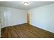 A bright bedroom features modern flooring with access to additional rooms at 6017 Whitaker Ln, Raleigh, NC 27603