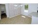 A bright dining area featuring built-in cabinets and a modern lighting fixture at 6017 Whitaker Ln, Raleigh, NC 27603