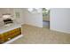 Cozy kitchen features granite countertops, a smooth cooktop, and ample cabinet space at 6017 Whitaker Ln, Raleigh, NC 27603