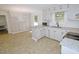 Bright kitchen with ample storage, featuring stainless steel appliances and sleek countertops at 6017 Whitaker Ln, Raleigh, NC 27603