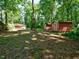 View of the backyard showing shed and screened in porch at 6017 Whitaker Ln, Raleigh, NC 27603