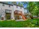 Townhome backyard featuring multi-level decks, green grass and beautiful landscaping at 603 Middleton Ave, Cary, NC 27513