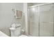 Cozy bathroom with tiled floors, a white vanity sink, toilet, and shower with sliding glass door at 603 Middleton Ave, Cary, NC 27513