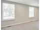 Bright bedroom with neutral walls and plenty of natural light at 603 Middleton Ave, Cary, NC 27513