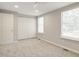 Bright bedroom featuring neutral walls, carpet flooring, and plenty of natural light at 603 Middleton Ave, Cary, NC 27513