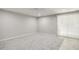 Neutral bedroom featuring carpet flooring and sliding glass door with tiled accent at 603 Middleton Ave, Cary, NC 27513