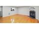 Inviting living room featuring hardwood floors and a modern fireplace at 603 Middleton Ave, Cary, NC 27513