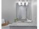 Bathroom with granite countertops, modern lighting, and ample counter space at 605 Larchwood Dr, Durham, NC 27713