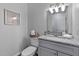 Bathroom with modern fixtures, granite vanity, and framed wall art at 605 Larchwood Dr, Durham, NC 27713