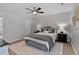 Bedroom with neutral walls, ceiling fan, and window for natural light at 605 Larchwood Dr, Durham, NC 27713