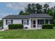 Charming single-story home with a screened-in porch and manicured lawn, offering cozy curb appeal at 605 Larchwood Dr, Durham, NC 27713
