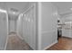 Hallway leading to kitchen and bedrooms with bi-fold closet doors for storage at 605 Larchwood Dr, Durham, NC 27713