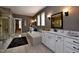 Elegant bathroom with double vanities, soaking tub, and natural light at , Wake Forest, NC 27587