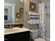 Stylish bathroom featuring a sleek black and white design, decorative tile, and modern fixtures at , Wake Forest, NC 27587