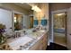 Bright bathroom featuring double sink vanity with granite countertops and a view into an adjacent bedroom at , Wake Forest, NC 27587