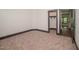 Empty bedroom with neutral carpet, gray trim, and closet at , Wake Forest, NC 27587