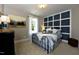 Cozy bedroom with a comfortable bed, decorative wall panel, and plenty of natural light at , Wake Forest, NC 27587