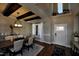 Bright dining area featuring dark wood floors, a modern light fixture, and views of a sunny window at , Wake Forest, NC 27587
