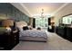 Serene main bedroom with tray ceiling, decorative wall, and natural light from the windows at , Wake Forest, NC 27587