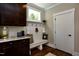 Functional mudroom with built-in bench, coat hooks, and granite countertops at , Wake Forest, NC 27587