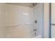 Clean and bright bathroom featuring a tub and shower combo with updated fixtures at 626 Hoover Rd, Durham, NC 27703