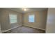 Cozy bedroom with carpet, blinds, neutral paint, and natural light at 626 Hoover Rd, Durham, NC 27703