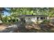 Charming single-story home featuring a covered carport and a well-maintained front yard at 626 Hoover Rd, Durham, NC 27703