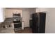 Updated kitchen with stainless steel appliances, granite countertops, and modern cabinetry at 626 Hoover Rd, Durham, NC 27703