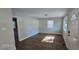 Bright living room with hardwood floors, neutral walls, and ample natural light at 626 Hoover Rd, Durham, NC 27703