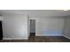 Open living room with modern wood-look flooring and neutral paint, ready for personal touches at 626 Hoover Rd, Durham, NC 27703