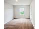 Cozy bedroom with neutral carpet and walls, featuring a window that provides natural light at 631 Southwick Pl, Mebane, NC 27302