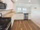 Well-equipped kitchen seamlessly connects to the living area, featuring stainless steel appliances at 631 Southwick Pl, Mebane, NC 27302