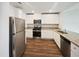 Modern kitchen with stainless steel appliances, granite countertops, and white cabinetry at 631 Southwick Pl, Mebane, NC 27302