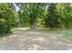 Large backyard with mature trees, a storage shed and plenty of space for outdoor activities at 7227 Cleveland Rd Rd, Clayton, NC 27520
