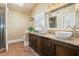 Bathroom featuring a double vanity, vessel sinks, granite countertops, and a walk-in shower at 7227 Cleveland Rd Rd, Clayton, NC 27520