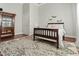 Bedroom featuring a wood-framed bed, display cabinet, and patterned rug on hardwood floors at 7227 Cleveland Rd Rd, Clayton, NC 27520