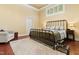 Bedroom featuring a bed, armchair, rug, hardwood floors and natural light from the window at 7227 Cleveland Rd Rd, Clayton, NC 27520